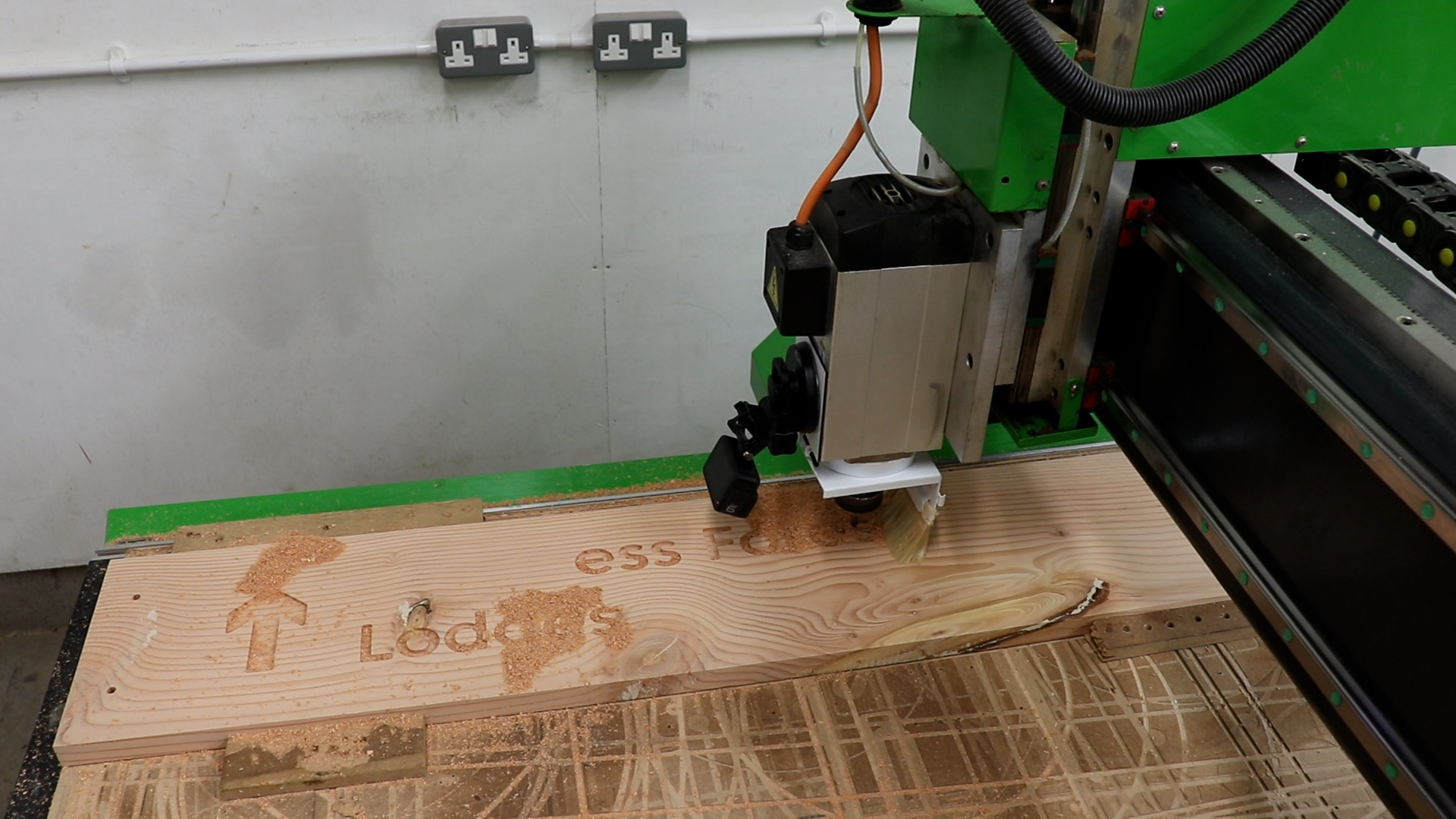 A sign being carved on a CNC machine